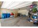 Spacious two-car garage with epoxy flooring and overhead storage racks at 440 Blue Lark Dr, Henderson, NV 89011