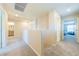 Upstairs hallway featuring neutral walls, carpet, and access to bedrooms and bathroom at 440 Blue Lark Dr, Henderson, NV 89011