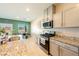 Well-equipped kitchen with modern appliances, granite countertops, and ample cabinet space for storage at 440 Blue Lark Dr, Henderson, NV 89011