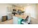 Modern kitchen features granite countertops, stainless steel appliances, and a breakfast bar with seating at 440 Blue Lark Dr, Henderson, NV 89011