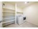 Laundry room with shelves and washer/dryer hookups at 440 Blue Lark Dr, Henderson, NV 89011