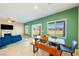 Bright and airy living space with large windows, a dining area, and comfortable seating arrangements at 440 Blue Lark Dr, Henderson, NV 89011