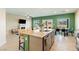 Open-concept kitchen flowing into living and dining areas, with modern decor and plenty of natural light at 440 Blue Lark Dr, Henderson, NV 89011