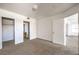 Bright bedroom with soft carpet, light walls, and access to a walk-in closet and bathroom, creating a comfortable layout at 45 Maleena Mesa St # 1321, Henderson, NV 89074