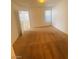 Bedroom featuring light-colored carpet, a window, and an open door leading into another room at 45 Maleena Mesa St # 1321, Henderson, NV 89074
