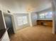 Bonus room featuring built-in desk area with drawers, neutral carpet, and multiple windows at 45 Maleena Mesa St # 1321, Henderson, NV 89074