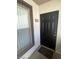 Apartment entrance featuring a black front door, unit number 1321, and a welcome mat at 45 Maleena Mesa St # 1321, Henderson, NV 89074