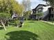 Beautifully landscaped exterior of modern apartment building with lush green lawn and mature trees at 45 Maleena Mesa St # 1321, Henderson, NV 89074