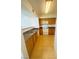 Clean kitchen featuring a pass-through, light wood cabinets, and standard appliances at 45 Maleena Mesa St # 1321, Henderson, NV 89074