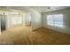 Bright and spacious living room with a ceiling fan and view into another room with neutral tones at 45 Maleena Mesa St # 1321, Henderson, NV 89074