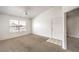 Bright living room featuring plush carpet, neutral walls, and a ceiling fan for a comfortable atmosphere at 45 Maleena Mesa St # 1321, Henderson, NV 89074