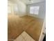 Bright, carpeted living room leading into other rooms and a large window letting in natural light at 45 Maleena Mesa St # 1321, Henderson, NV 89074
