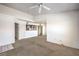 Inviting living room with a view into the kitchen, carpeted floors, and neutral walls, ready for personalization at 45 Maleena Mesa St # 1321, Henderson, NV 89074