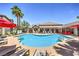 Community pool with lounge chairs, umbrellas, and a spa at 45 Maleena Mesa St # 1321, Henderson, NV 89074