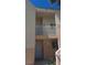 Two-story condo building featuring neutral stucco exterior and gated entry at 5000 Red Rock St # 248, Las Vegas, NV 89118