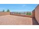 View of the backyard with a brick fence, and view of the mountains in the background at 5398 Robinera Ct, Las Vegas, NV 89166