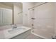 Bathroom with white cabinets, shower and bath, and a large mirror at 5398 Robinera Ct, Las Vegas, NV 89166