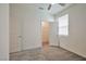 This bedroom has neutral walls, a closet with an open door, carpeted floors, and a window at 5398 Robinera Ct, Las Vegas, NV 89166