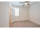 Cozy bedroom with carpet, a ceiling fan, and a window providing natural light at 5398 Robinera Ct, Las Vegas, NV 89166
