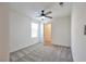 Bright bedroom features neutral walls, carpet flooring, ceiling fan, and closet at 5398 Robinera Ct, Las Vegas, NV 89166