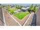 Aerial view of a community park with green grass, gazebo, and walkways at 5398 Robinera Ct, Las Vegas, NV 89166
