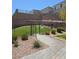 View of a community dog park behind a fence with a grassy area and trees at 5398 Robinera Ct, Las Vegas, NV 89166