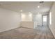 Bright hallway features neutral paint, carpeted floors, and recessed lighting throughout at 5398 Robinera Ct, Las Vegas, NV 89166