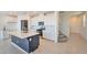 Open kitchen featuring stainless steel appliances, ample cabinetry, and large island with counter seating at 5398 Robinera Ct, Las Vegas, NV 89166