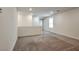 Bright, open living room with neutral carpet and recessed lighting offers versatile living space at 5398 Robinera Ct, Las Vegas, NV 89166