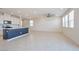 Bright open-concept living space featuring tile floors, recessed lights, and an island at 5398 Robinera Ct, Las Vegas, NV 89166