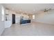 Open concept living area with tile floors, recessed lighting and a kitchen island at 5398 Robinera Ct, Las Vegas, NV 89166