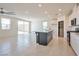 Bright and airy living room featuring tile floors, recessed lighting, and access to the kitchen at 5398 Robinera Ct, Las Vegas, NV 89166