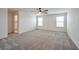 Spacious living room features abundant natural light, carpet flooring, and airy atmosphere at 5398 Robinera Ct, Las Vegas, NV 89166