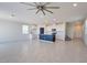 Open concept living space featuring a modern kitchen island, tile floors, and recessed lighting at 5398 Robinera Ct, Las Vegas, NV 89166