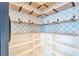 Walk-in pantry with custom shelving and stylish patterned wallpaper for optimal organization at 5398 Robinera Ct, Las Vegas, NV 89166