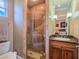 Bathroom with a walk in shower, vanity, granite countertops, and stylish mirror at 5416 Alabaster Ct, Las Vegas, NV 89149