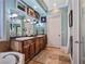 Well-lit bathroom with double sinks, bathtub, and decorative artwork for a welcoming atmosphere at 5416 Alabaster Ct, Las Vegas, NV 89149