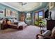 Bedroom with tray ceiling, French doors, and stylish decor at 5416 Alabaster Ct, Las Vegas, NV 89149