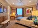 Cozy bedroom with a large window, soft carpet, and comfortable furnishings creating a relaxing space at 5416 Alabaster Ct, Las Vegas, NV 89149