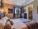 Bedroom with a view of the pool, dresser and stylish furnishings at 5416 Alabaster Ct, Las Vegas, NV 89149