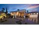 Charming home exterior with well-manicured landscaping and inviting curb appeal at twilight at 5416 Alabaster Ct, Las Vegas, NV 89149