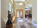 Bright and spacious foyer featuring detailed tile flooring, custom doors, and high ceilings at 5416 Alabaster Ct, Las Vegas, NV 89149