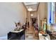 Grand foyer with a high ceiling, statues, travertine flooring, and custom lighting at 5416 Alabaster Ct, Las Vegas, NV 89149