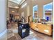 Grand foyer with a high ceiling, statues, travertine flooring, and custom lighting at 5416 Alabaster Ct, Las Vegas, NV 89149