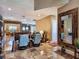 Spacious living area with tile flooring, comfortable seating, and fireplace at 5416 Alabaster Ct, Las Vegas, NV 89149