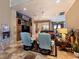 Open living area with tile flooring, fireplace, built ins and comfortable seating at 5416 Alabaster Ct, Las Vegas, NV 89149
