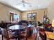 Inviting living space with a piano, round table, and an abundance of natural light at 5416 Alabaster Ct, Las Vegas, NV 89149