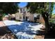Large backyard with a spacious patio and lush greenery creating shade at 5808 Amber Station Ave, Las Vegas, NV 89131