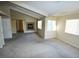 Large bedroom featuring a vaulted ceiling, multiple windows, a fireplace, and access to the bathroom at 5808 Amber Station Ave, Las Vegas, NV 89131
