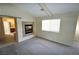 Cozy bedroom featuring a fireplace, a window with blinds and easy access to the bathroom at 5808 Amber Station Ave, Las Vegas, NV 89131